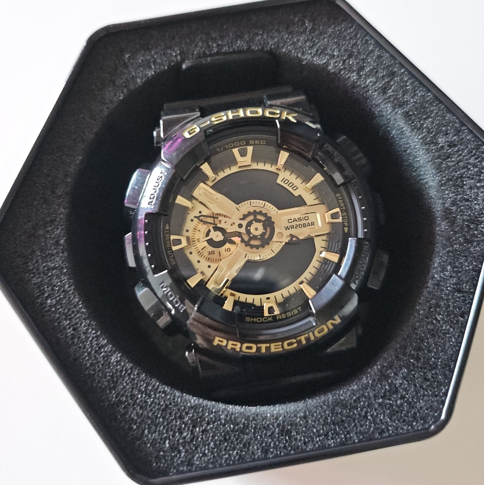 Casio Black and Gold Watch with Analog-Digital Display